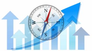 Symbolbild: blaue Pfeile, die nach oben zeigen, überlagert von einem Kompass